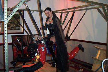 Mistress Amanda Wildefyre watched as I rode her Charger Pony at the Midwest Fetish Spring Sting 2002 BDSM convention in Moundsview, Minnesota